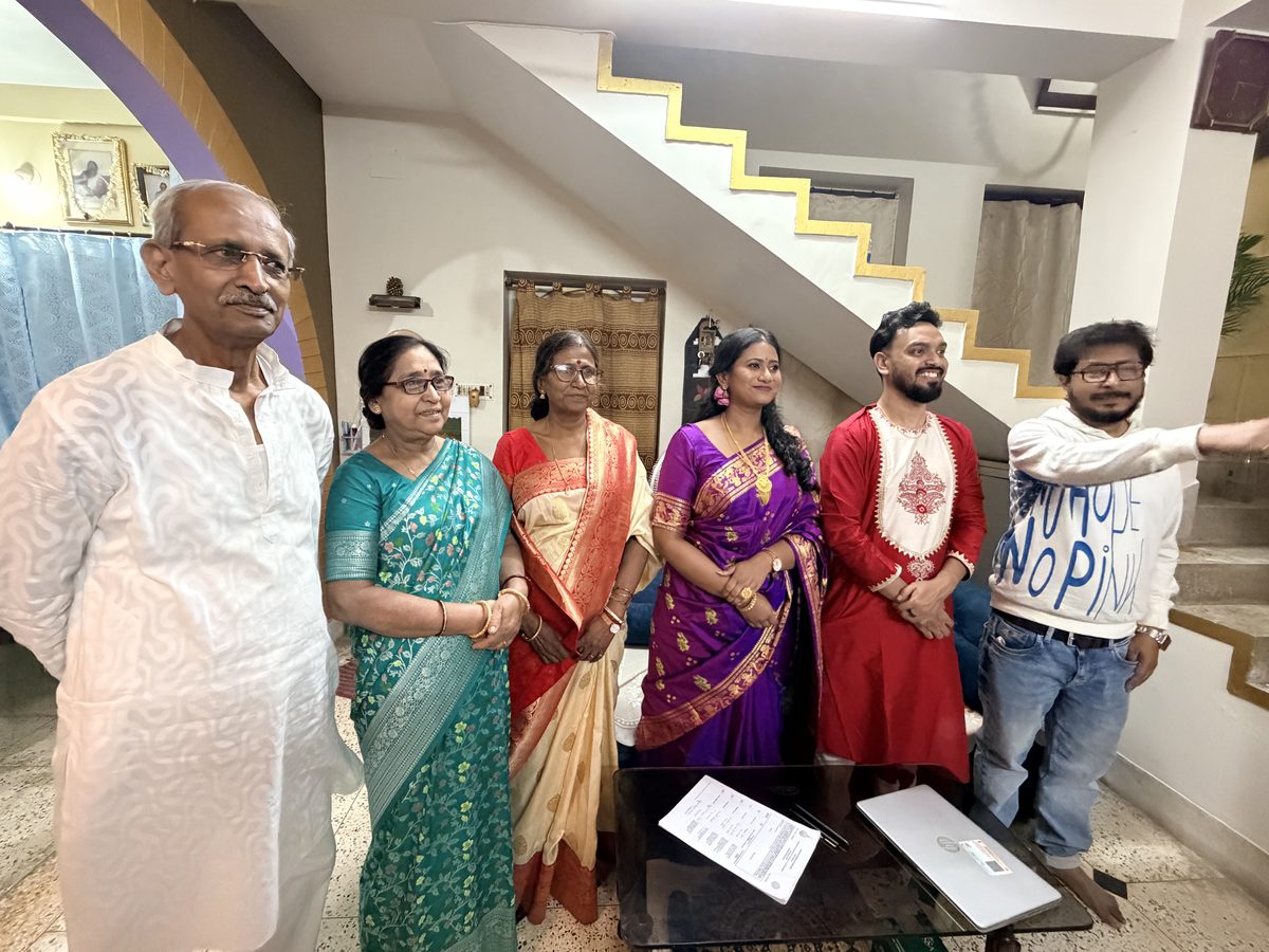 Extended family group photo in traditional attire