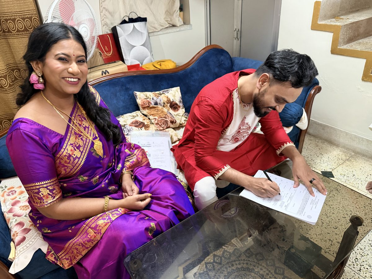 Rituparna and Shoumo at the dining table with other guests