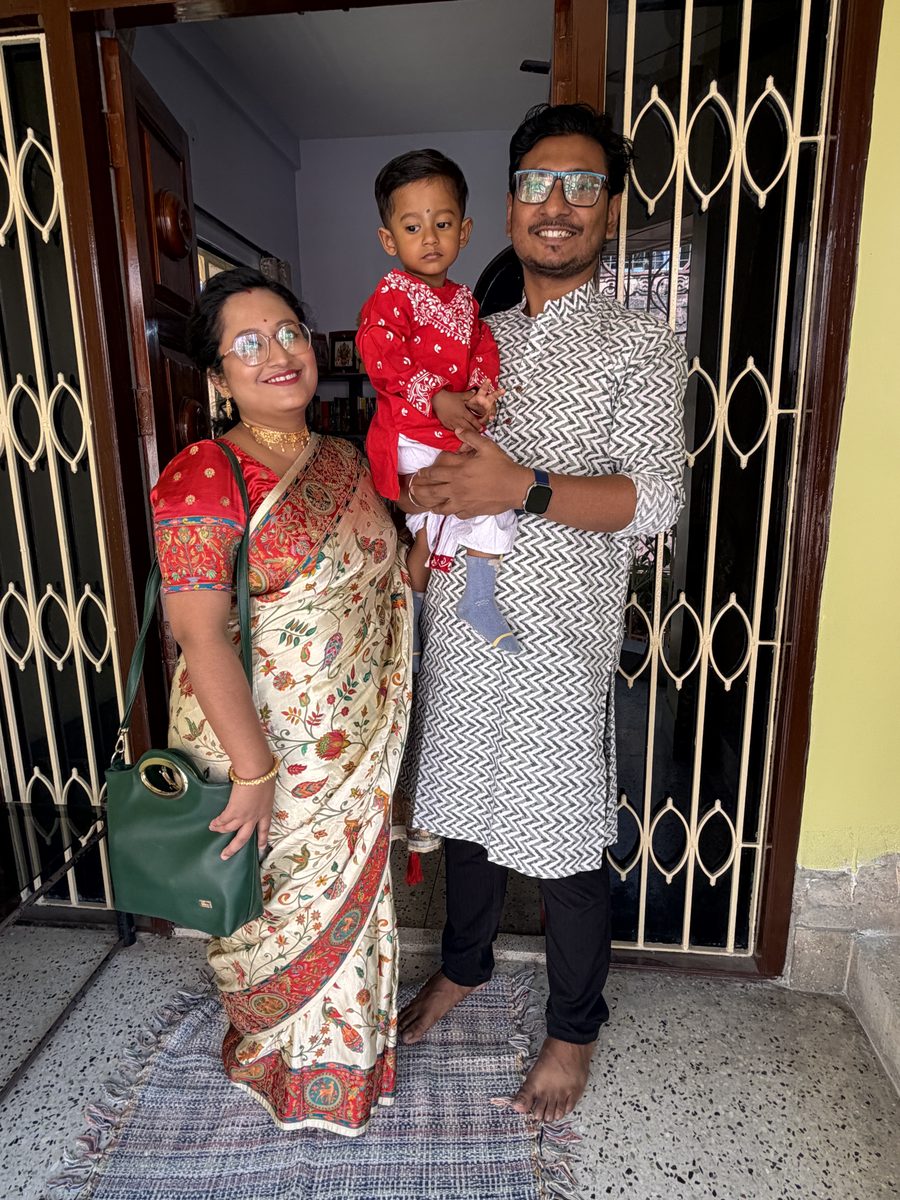 Mixed group of men and women seated together indoors during the ceremony