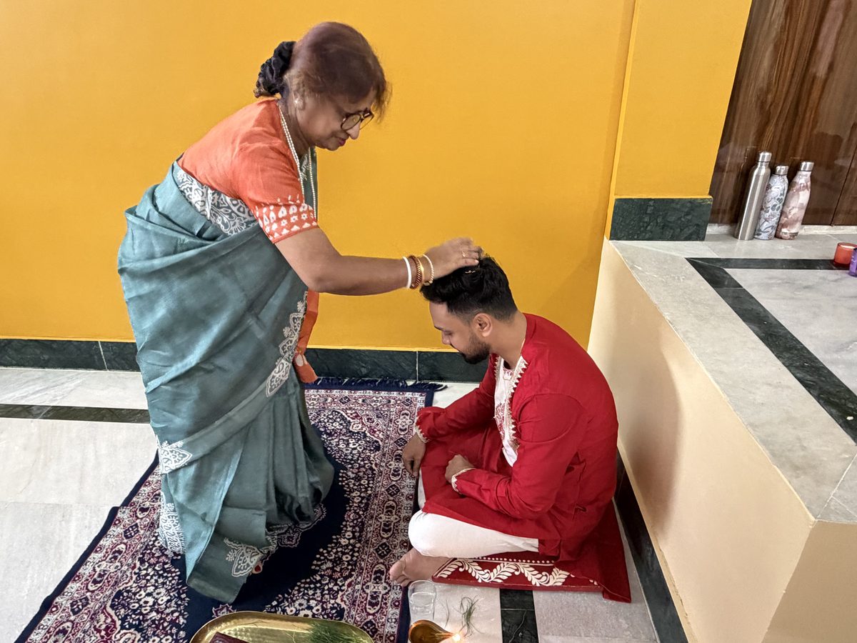Elderly woman blessing Shoumo in an intimate close moment