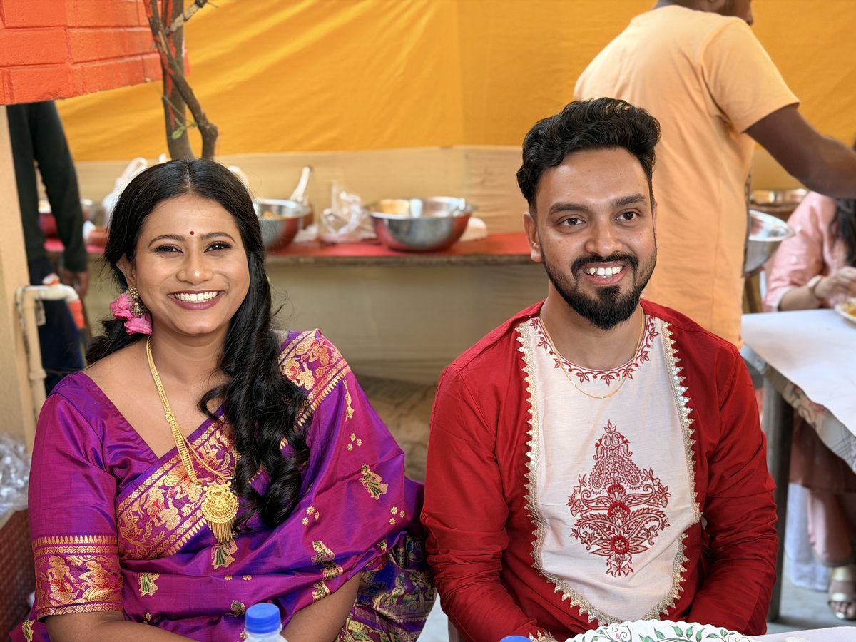 Rituparna and Shoumo smiling happily together at the celebration venue