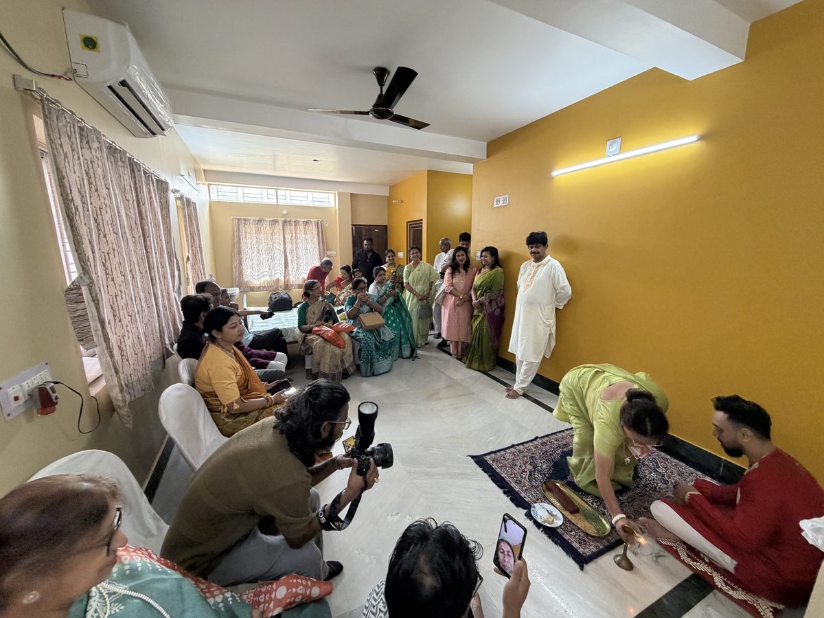 Wide-angle view of the large family gathered in the ceremony room