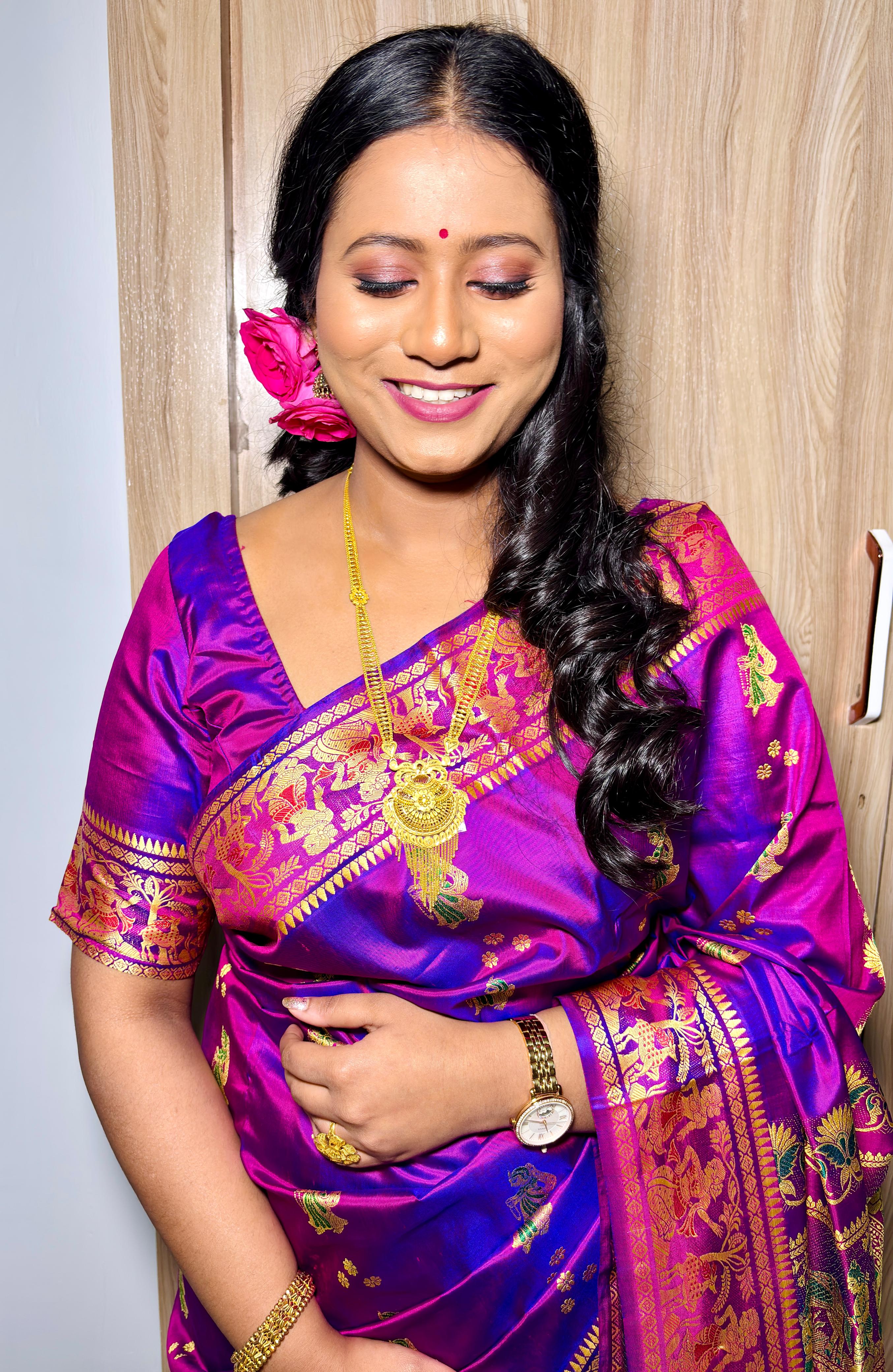 Rituparna in a candid moment, gentle smile in her purple Banarasi
