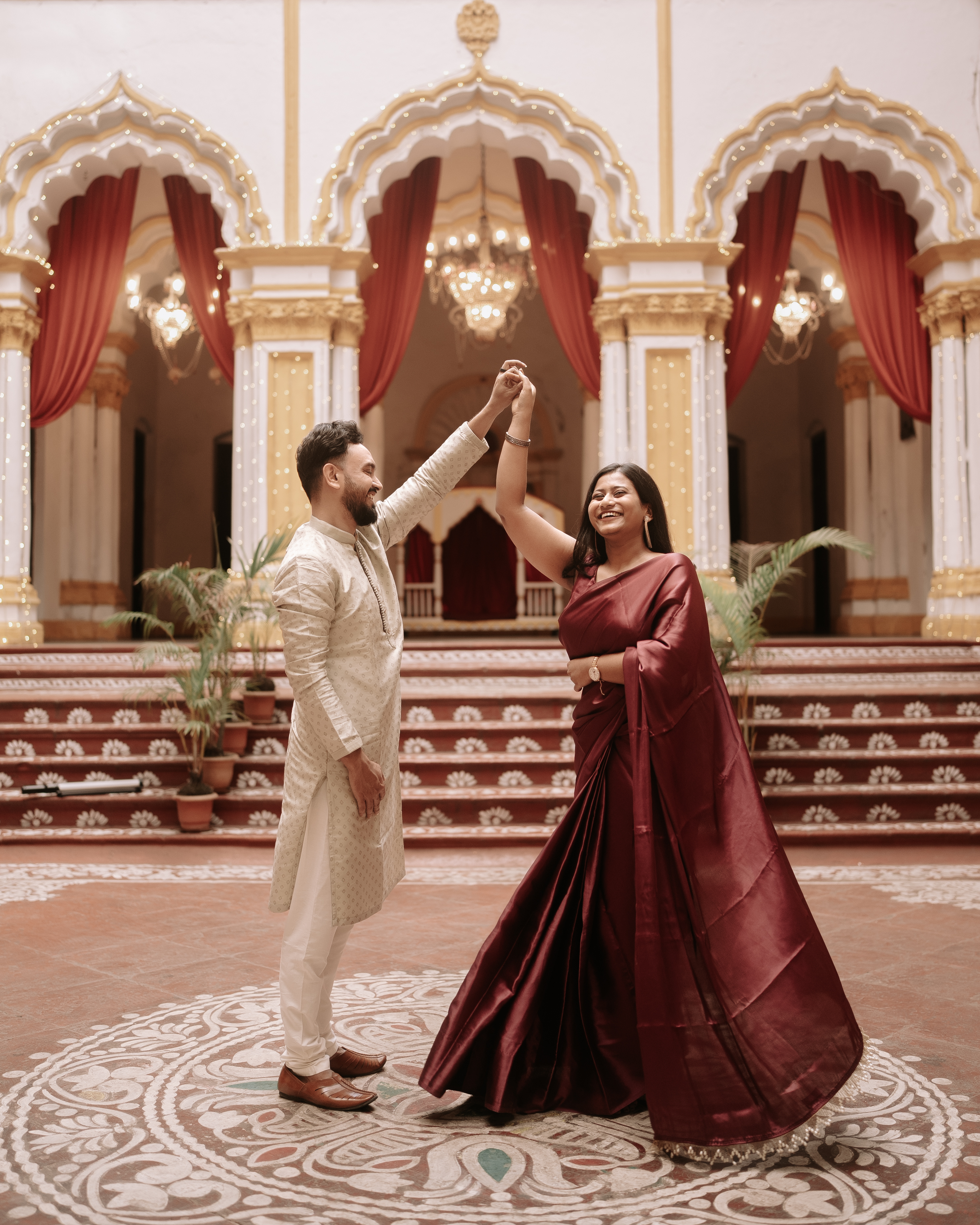 Rituparna and Shoumo dancing and twirling joyfully in the palace hall