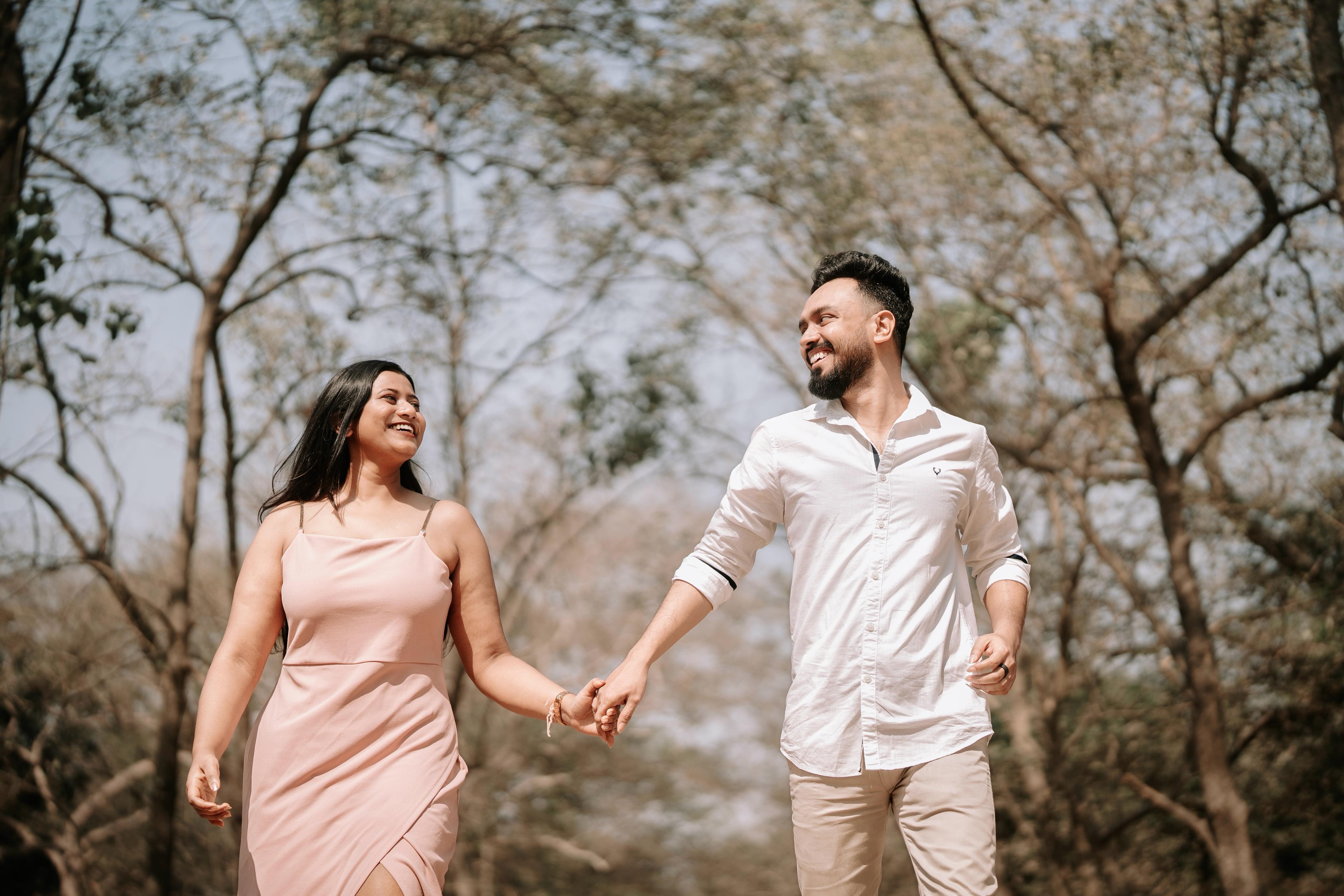 Rituparna and Shoumo walking hand in hand, looking at each other and laughing